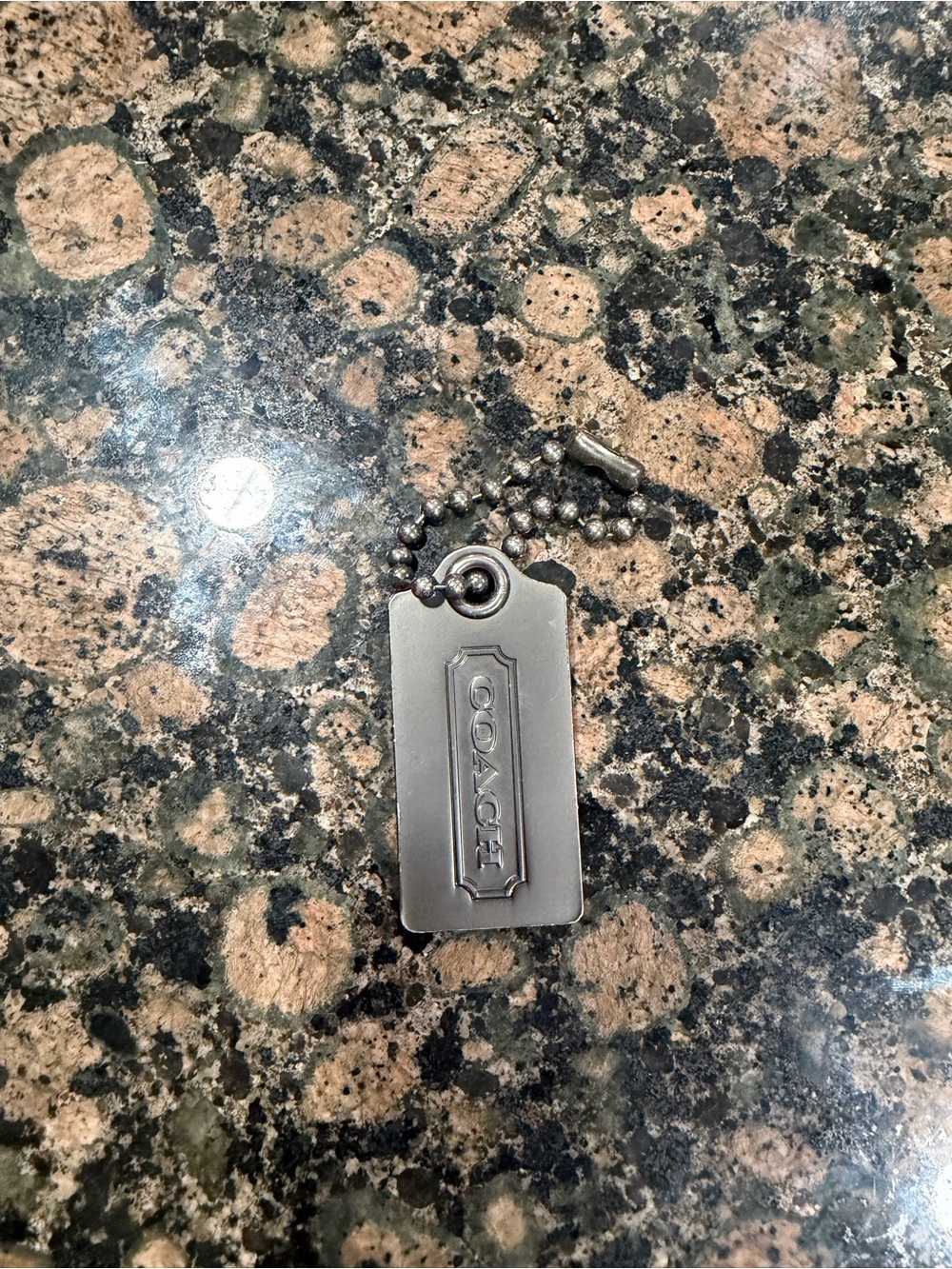 COACH Silver Metal Tag- Silver
